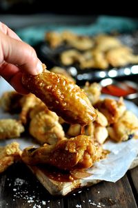 The secret to truly crispy baked wings: tossing in baking powder and starting off the baking on a low temperature to render out the fat. A Cook's Illustrated recipe.