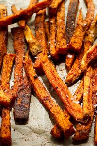 NYT Cooking: These addictive seasoned "fries" from Mark Bittman are actually baked, but we promise you won't miss the grease. The spice mix – garlic powder, paprika, salt and black pepper �– can be used on regular potatoes as well (you'll just need to increase the baking time a bit).