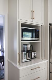 Warm White Kitchen with Two Gray Islands