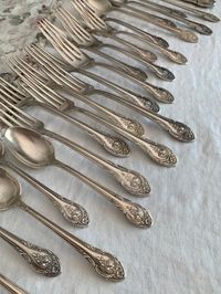 Vintage silver plated silverware Rosemont By Gorham. Beautiful with rose pattern and a heavier weight than some.  Very nice condition the set does show use scratches but not damaged. Some pieces have more of the darkening in the patterned area.  Not a complete set perfect for one needing to add to an existing set. You will receive  12 teaspoons  5 long handle teaspoons  6 salad forks 6 dinner forks 5 knives 1 butter knife 1 sugar spoon 36 pcs in all.