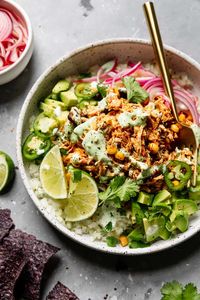 With just 15 minutes of prep time, Instant Pot Salsa Chicken makes for the perfect weeknight dinner. It's quick to make, made with real food ingredients, and delivers flavors that both kids and adults will like. Budget-friendly, this juicy and tender salsa chicken is topped with cilantro-lime crema and served as a burrito bowl.