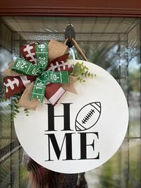 16 inch birch wood, wooden round door hanger/door sign Football season themed handcrafted bow/hand painted/hand stained *all products are made with glue and staples* Do not forget to fluff your bow after opening your package