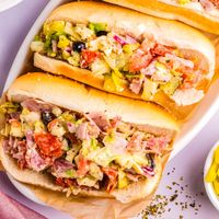 Ditch the boring sub; it's Chopped Italian Sandwiches time! This quick and flavorful recipe lets you choose your favorite cold cuts, veggies, and dressing, then chops it all up for a fun and delicious experience. Perfect for lunch, dinner, or social media sharing!