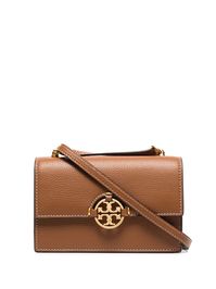 Light umber leather mini Miller shoulder bag from TORY BURCH featuring gold-tone hardware, single braided shoulder strap, single chain-link top handle, single flat top handle, foldover top with magnetic fastening, internal slip pocket, internal zip pocket, contrast stitching and signature Double T monogram plaque at the front.