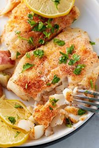 A flaky oven-baked cod that's buttery, and garlicky with a burst of lemon. This refreshing and light main course is perfect for a weeknight dinner. These baked cod fillets will be a family favorite!