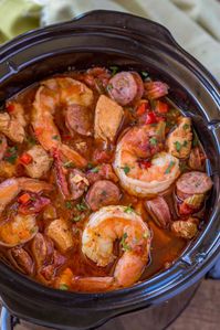 Slow Cooker Jambalaya with andouille sausage, chicken and shrimp cooked low and slow with bold spices and vegetables with just ...