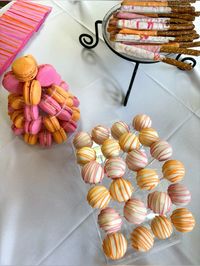 Grad party dessert table orange and pink cakepops and macarons