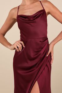 A wow-worthy look like the Lulus Moments of Beauty Plum Purple Satin Cowl Neck Tulip Maxi Dress is ready to make everyone stop and stare! Sleek woven satin shapes this gorgeous dress that features a sleeveless bodice, a cowl neckline, and adjustable spaghetti straps that crisscross at the back. The fitted waist tops a gathered, figure-skimming tulip-style skirt that finishes at a sophisticated maxi hem. Hidden back zipper/clasp. Fit: This garment fits true to size. Length: Floor length. Size med