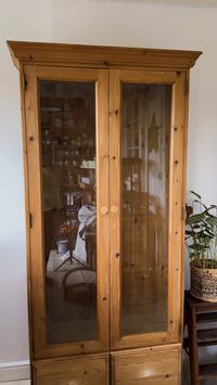 This curio cabinet was given a modern and beautiful makeover with Collard Greens Chalk Mineral Paint.