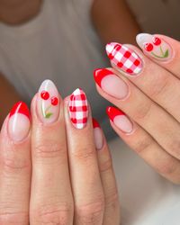 These nails feature a vibrant summer design with red French tips, cherry accents, and a playful red and white gingham pattern. Perfect for a picnic in the sun!  🌸Click on the image to shop our trending Korean Gel Polish this season.  🌸Credit: dazeynailco on Instagram 🌸summer nails, red French tips, cherry nails, gingham nails, picnic nails, Korean gel polish, nail art, red and white nails, cherry accents, trendy nails, summer nail trends, nail design, summer manicure, fresh nails, vibrant nails, picnic-inspired nails, Korean nail trends, gel polish, seasonal nails, Instagram nails