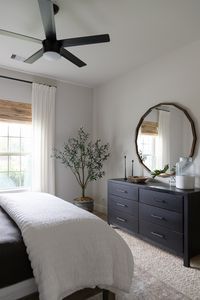 Neutral bedroom makeover with Bench*Made midtown dresser from Bassett furniture and faux olive tree