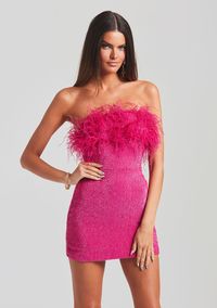 Stand out in our Torin Dress. This showstopping sequin mini dress features a strapless neckline and flirty feather trim at the top. Hidden zipper with hook-and-eye closure at the side. Shown here in Hot Pink. HANDMADE Self: 100% Viscose, Trim: 100% Ostrich Feather Made in India Model is 5'11" wearing size XS Style No.