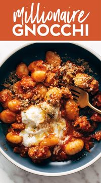 Millionaire Gnocchi! You're going to feel like a million bucks when eating this delicious Millionnaire Gnocchi! Pillowy gnocchi, melty herbed ricotta, fresh herbs, and surprise little crunches from the savory golden brown breadcrumbs you sprinkled on top. #gnocchi #pasta #redsauce