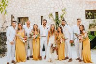 This eclectic destination wedding in Tulum, Mexico featured so many festive details. Golden yellow Show Me Your Mumu bridesmaids dresses, wedding jackets, a bridal hat, boho rugs, pampas grass, maracas and a donkey at the cocktail hour were just some of the fun details! #gws #greenweddingshoes #mexico #destinationwedding