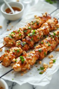 Grilled Honey Garlic Chicken Skewers served on parchment paper, showcasing a delicious summer recipe ideal for easy meals and weekend barbecues.