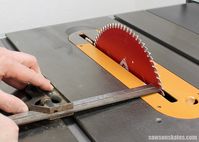 Tune Up Your Table Saw - Place a combination square in the miter gauge slot, against the saw blade and measure the distance