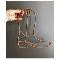 Add a touch of Texas charm to your space with this cowboy boot shape decor for the wall! Handcrafted with attention to detail, this unique piece is the perfect addition to any Western-themed room , nursery ,kids bedroom or country-inspired home. Hang it up in your living room, bedroom, or even in your entryway to showcase your love for all things cowboy. Made from cotton cord and sturdy wire  this wall decor is built to last and will surely be a conversation starter for your guests. Upgrade your