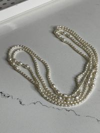 "33 1/2\" long string of cultured pearls Jeweler said worth about 150.00 Good condition All one string, no clasps"