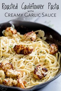 This Roasted Cauliflower with Creamy Garlic Pasta is an elegant yet simple vegetarian pasta dinner. Perfect for entertaining or dinners on meatless Monday. The cream and garlic come together to make a creamy dreamy sauce that is pure comfort food, whilst the roast cauliflower gives some texture to the pasta. This really is a delicious vegetarian dinner. #vegetarianpasta #cauliflowerpasta