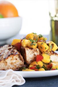 This easy citrus-marinated mahi mahi with sweet-and-sour mango relish has all the right components for a fresh, summery meal. Serve it with island rice and a salad, or with tortillas for taco night.