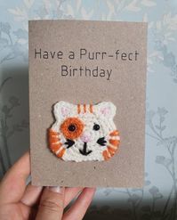 Handmade Have a purr-fect birthday card, with a hand crocheted cat.Perfect to celebrate someone's birthday.Cards are C6 size, 280gsm and made from recycled paper and come with an envelope which is 120gsm. Cards are left blank inside for you to add your own message.As with most of our products, if you would like a change of colour, or something smaller or larger, or some extra additions then please message me or request a custom order.*Due to this being a handmade product each item is individual