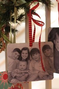 A family photo ornament for every year - photo Mod Podged onto a thin wooden plaque.