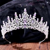 Inspired by the old days of royalty when times were filled with extravagant parties and lavish luxuries, this unique tiara conveys a modern take on old elegance and grand entrances. Adorned with intricately faceted purple crystals that work their way across the band in a swirly pattern and capturing the light from every angle with a perfectly translucent appeal, this exquisite tiara can complete the most sophisticated of bridal looks. Cast in lightweight alloy and silver plated for a flawless fi