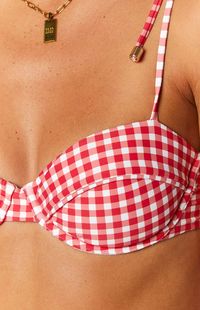 Red Gingham Tie Up Bikini Top  How to style: Our red gingham tie up bikini top () is a Summer favourite! Style with the matching bikini bottoms () as the perfect ensemble for your next beach day. Throw over a white crochet dress () and sandals for the cutest beach cover.  Features:     * Removable padded bust cups   * Underwire design   * Adjustable shoulder tie detailing   * Centre back hook closure - 3 adjustable options   * Stretch fabric   * Red gingham print   * Lightweight material   * Mad