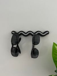 Keep your sunglasses organized and within reach with our stylish 3D Printed Wall Mount Sunglasses Holder! This sleek and modern design is perfect for displaying your favorite pairs while saving space. Available in a variety of vibrant colors, you can choose the perfect match for your décor. Made from durable, high-quality materials, this holder is easy to install and adds a touch of convenience to any room. Elevate your accessory game with this must-have organizer! Choose from many colors to cus