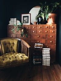 Vintage studio space with handmade apothecary cabinet and handmade leather and resin art books.