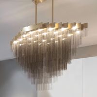 The Kelly XL Chandelier is a linear chandelier that displays cascading Metallic chains on various layers to create a glamerous reflective effect. It features a Black or Brass frame with matching chains that will bring an Art Deco aesthetic to any space. Stem is not field adjustable.