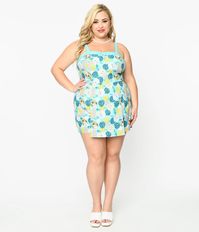 This retro plus size 1950s style romper in collaboration with The Golden Girls, is crafted in a lightweight aqua blue woven cotton and boasts an all over print of Blanche, Rose, Dorothy, and Sophia, and monstera leaves.