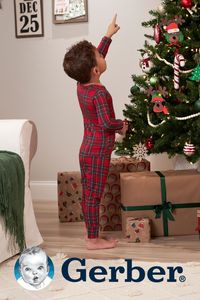 This two-piece Christmas pajama set is perfect for babies and toddlers. With a classic red and green plaid pattern with white highlights, the whole family can match for the holiday season.