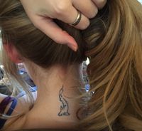 Minimalist feminine neck shark tattoo