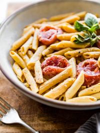 A gluten free pasta dinner with creamy tomato sauce, ready to eat in 25 minutes! This easy dinner recipe is protein packed, vegetarian, and dairy free! #glutenfree #pasta #dairyfree #healthydinner