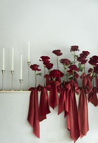 Red ribbons stacked on roses