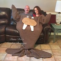 This is a crochet PATTERN for a thick and bulky walrus blanket for two people to share! This whimsical walrus has a hilarious face and body, which lies flat across two people, and also cocoons around your legs for added warmth and comfort. The walrus flippers serve as pockets for your hands! This blanket is fun to share, but just as great to use alone!