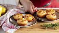 Puff pastry roses are an elegant appetizer that pairs sweet pears, creamy Brie, and flaky pastry in a bite-sized delight that will impress any guest.