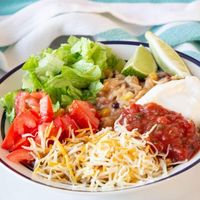 Try out this Instant Pot Burrito Bowl! Seasoned chicken, black beans, rice, corn, and more. A dump and go instant pot chicken recipe! Whip this up for meal prepping lunches and dinners or to serve your whole family. Seasoned chicken, rice, black beans, corn, Rotel, all cooked in one-pot! #pressurecooker #Instapot #instantpot #chicken #Mexican #burritobowl #tacobowl #chicken #easy #quick #dumpandgo