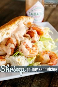 Shrimp Po Boys are the ultimate sandwich for seafood lovers! Tender shrimp drizzled with creamy, spicy sauce topped with crunchy cabbage on a soft roll.  #shrimp #shrimpsandwich #shrimppoboy #poboy #seafood #seafoodsandwich #FavoriteFamilyRecipes #favfamilyrecipes #FavoriteRecipes #FamilyRecipes #recipes #recipe #food #cooking #HomeMade #RecipeIdeas