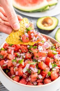 This fresh watermelon salsa recipe is refreshing twist on a classic salsa. Bursting with flavor, this is a delicious and healthy dip that's perfect for any get togethers or holiday gatherings. Plus it's not only great with tortilla chips but even as a topping for grilled fish or chicken.