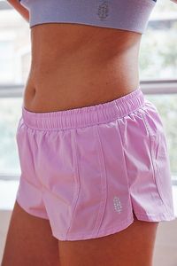 Mini and mighty, these run shorts feature a durable, water-resistant fabrication in a so-tiny silhouette with a built-in, sweat-wicking brief for added coverage and comfort on the run. **Fit:** Fitted; micro length **Features:** Durable, water-resistant fabrication; built-in brief liner with sweat-wicking fabric; low-rise; micro-silhouette; drop-in back pocket; drawstring adjustable waistband **Why We | Itty Bitty Run Shorts by FP Movement at Free People, Bright Orchid, M