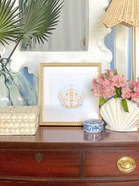 "Decorate your home affordably with this digital artwork that's easy to print out at home.  Art features a beige and white sea shell with a very pale blue background.   You will receive a DIGITAL FILE only. No hard copies will be mailed to you. I recommend you print on card stock and trim as needed. The frame in the photo is https://rstyle.me/+MaQD0JMwO3LiI4Mk3ybSvw and has an 8\"x8\" opening.  I printed on an 8.5\"x11\" piece of cardstock from my printer.  The actual sea shell design is approxi