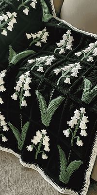 Create a stunning afghan and pillow with this intermediate Lily of the Valley crochet pattern. Detailed stitch instructions included. Click to start your floral project!