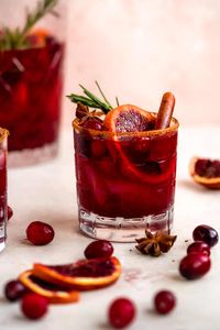 What better way to get into the holiday spirit than with Blood Orange Cranberry Sangria! Nothing livens up a gathering (big or small) like a big batch of sangria outfitted with fresh fruit, a little ginger beer, and a generous dose of some classic fall flavors. It's easily made in a big pitcher and gets even better with time to soak up all the juices! In other words, it's a holiday party must!