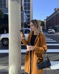 Cozy up in the Fleet Street Camel Cardigan Sweater this season! Warm camel knit, with black stripe trim, forms the chic cardigan with a collared neckline, wide lapels, long cuffed sleeves, and long, open bodice with patch pockets.