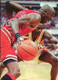 The GOAT drives on the Hawks' Dominique Wilkins in Atlanta.