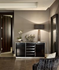 Luxury International Interior Architecture and Design project by Katharine Pooley. Console styling. Herringbone floor. Ebony doors.