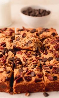 These pumpkin oatmeal bars with dark chocolate chips are the perfect fall season dessert. They have perfectly spiced pumpkin, chewy oatmeal, dark chocolate chips, and pecans. These make a perfect addition to your holiday dessert table!