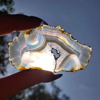 This beautiful Rainbow Iris Agate Slice is available at Simply Affinity. These rainbow agate slices are incredibly rare and found in Indonesia. They look like a regular slice of agate until viewed through transmitted light, and then an incredible spectrum of colors appears. There are said to be a very small percentage of iris agates in the world.   #SimplyAffinity #Crystals #Gemstones #IrisAgate #Metaphysical #Agate #RainbowAgate #MetaphysicalProperties